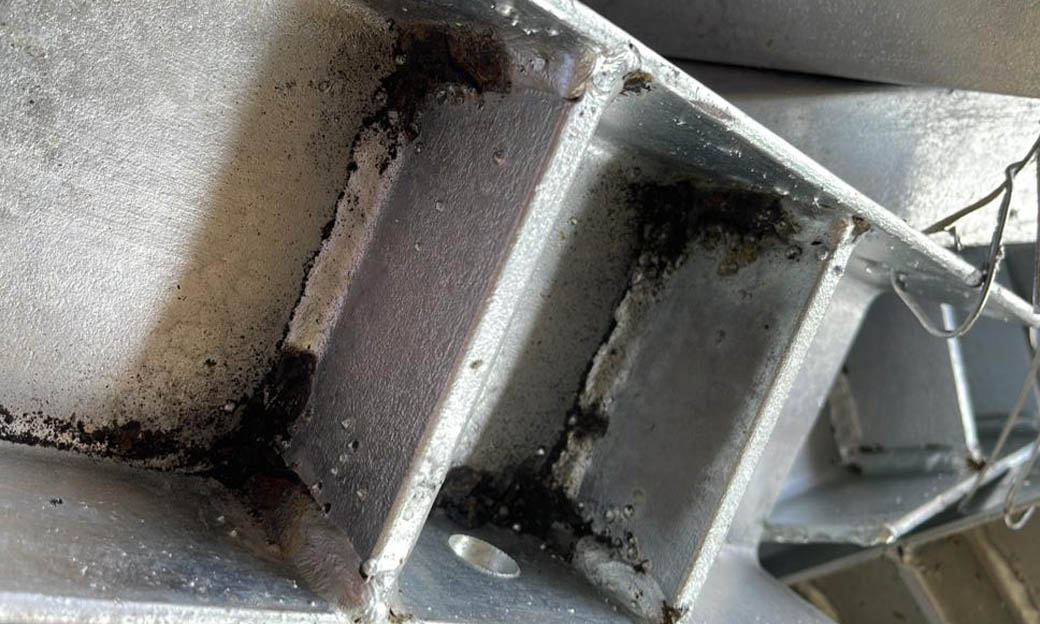 FABRI_0003_Bare Spots under weld slag not removed prior to galvanizing